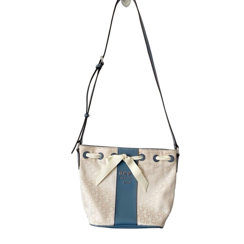 DKNY Ivory Cream and Blue Trims Lace Bow Front Bucket Style Crossbody Purse Bag gallery