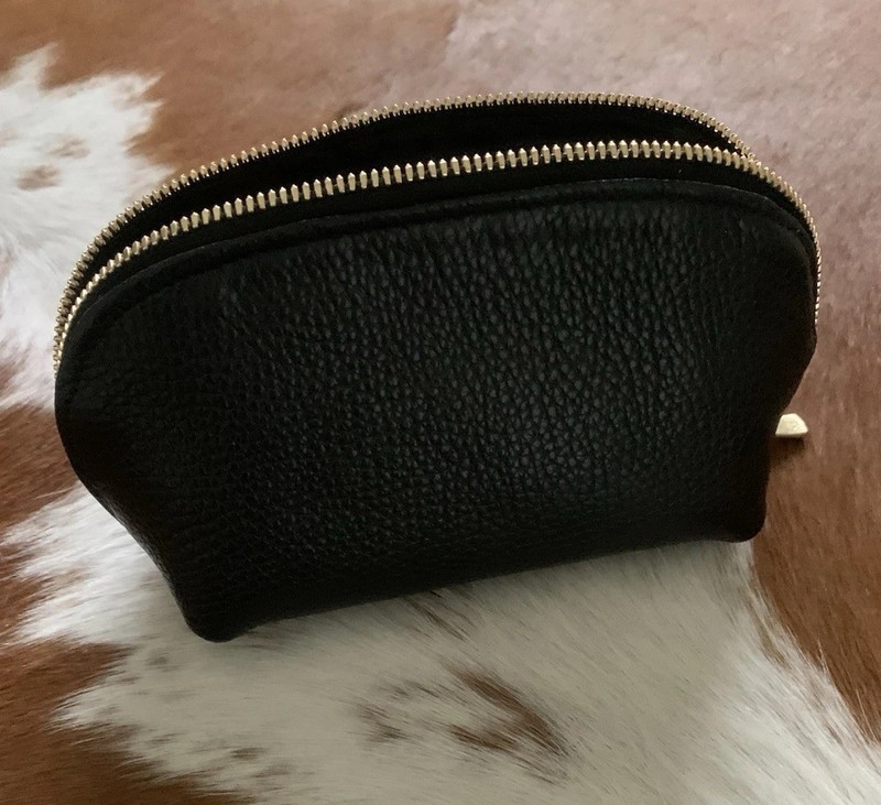 Gorgeous genuine black leather with gold zippers makeup bag