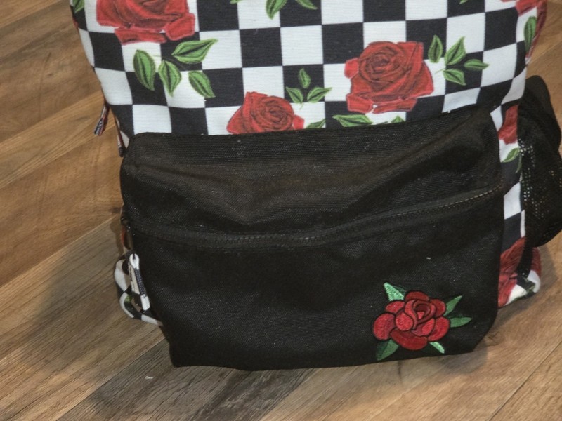 Spencer’sCheckered Rose Backpack