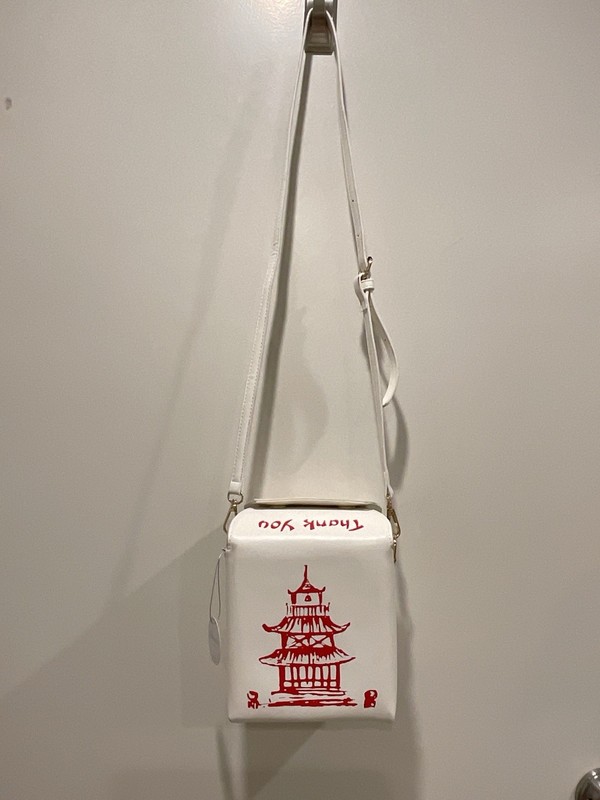 This novelty white Chinese takeout box-shaped crossbody.