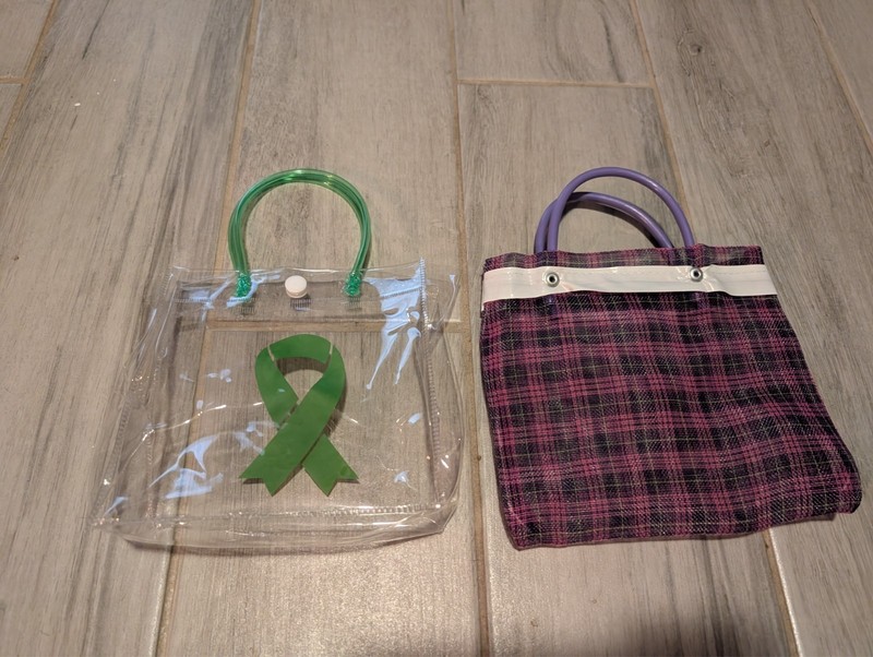 Two Purses – 1 Clear One with Cancer Ribbon Design & 1 Purple One