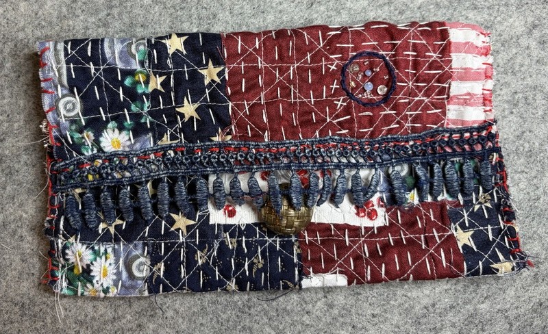 Patriotic beaded Sashiko hand-sewn pouch with button closure.