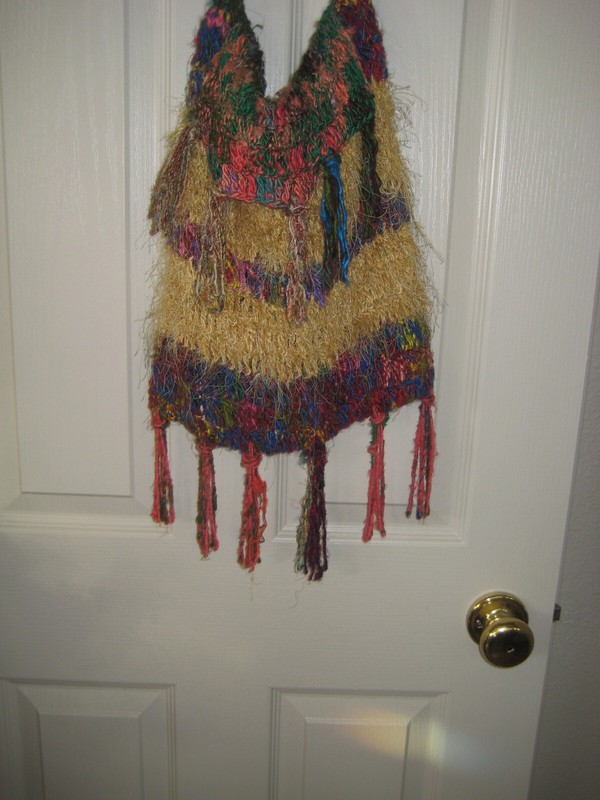Handmade colorful handbag. Lined w attached closure Crocheted /knitted. gallery