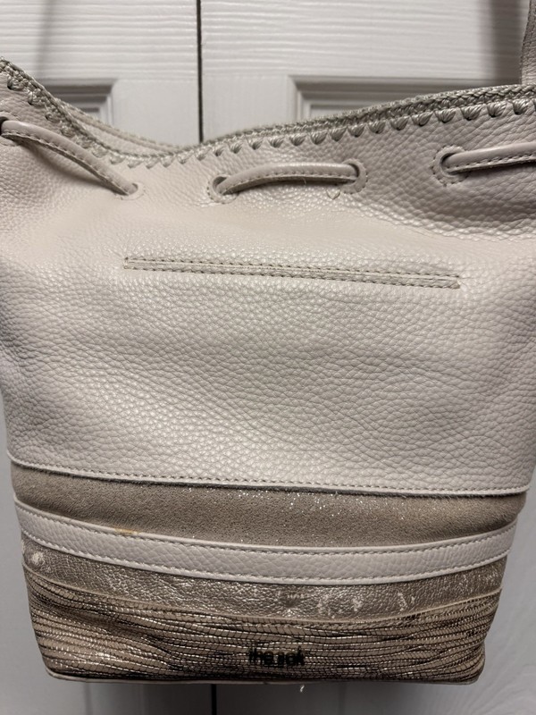 The Sak Ivory Leather Bucket style , 3 small strips of color leather at Bottom gallery