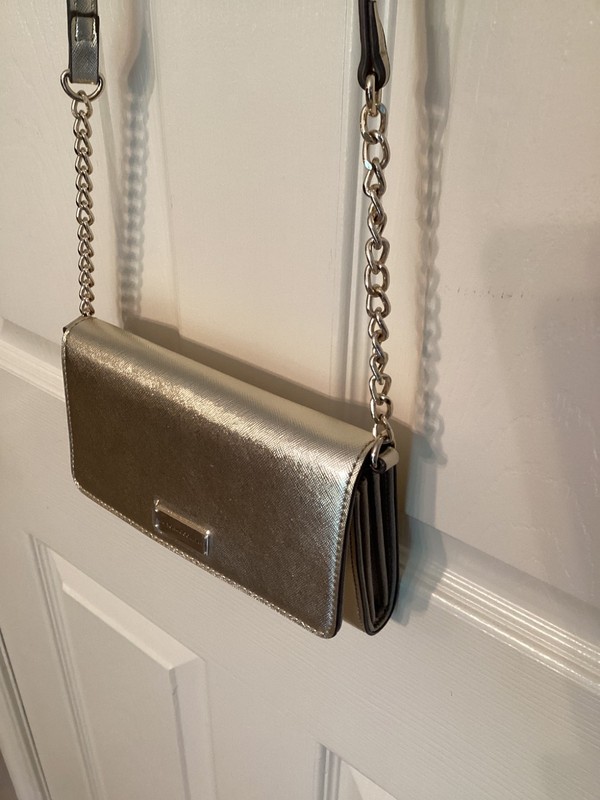 New York & CO. Gold crossbody purse 4 1/2 inch by 7 inch. Removeable strap.