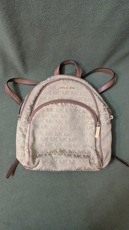 Used Michael Kors Abbey Backpack Medium. 12″ wide.