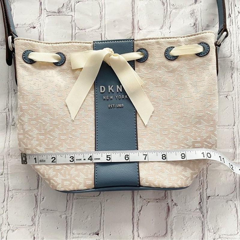 DKNY Ivory Cream and Blue Trims Lace Bow Front Bucket Style Crossbody Purse Bag gallery