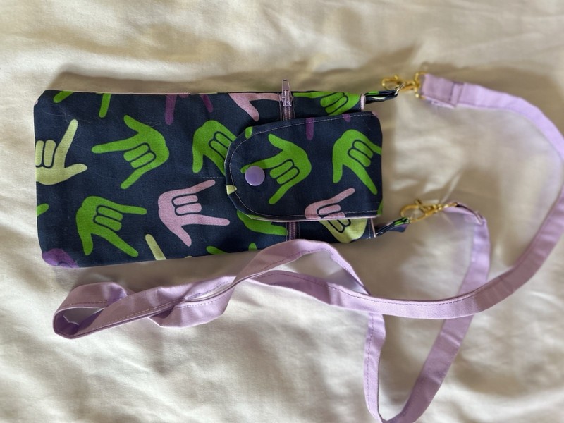 Women’s Small Black Peace Graphic Crossbody, Zip + Snap Pocket, Purple Strap