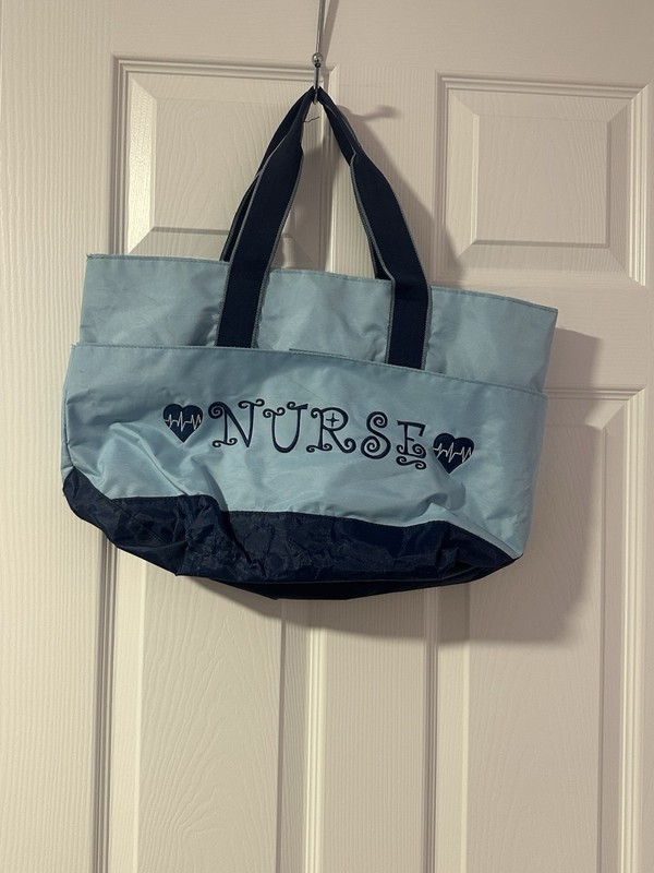 Nurse embroidered light blue navy tote bag with heart design and snap closure