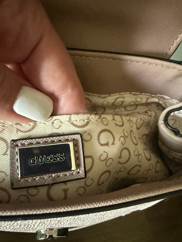 GUESS Wesley mini backpack in a light rose pink. gallery
