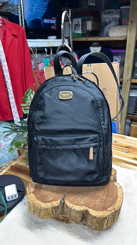 Michael Kors Jet Set Large Nylon Backpack Black / Gold Tone name tag