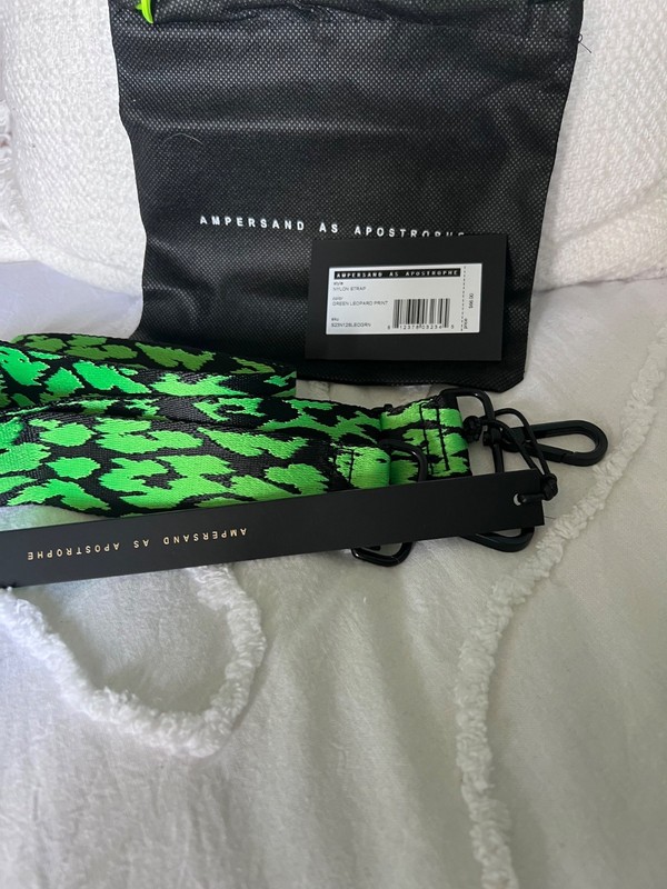Ampersand as Apostrophe crossbody nylon strap. Green leopard print.