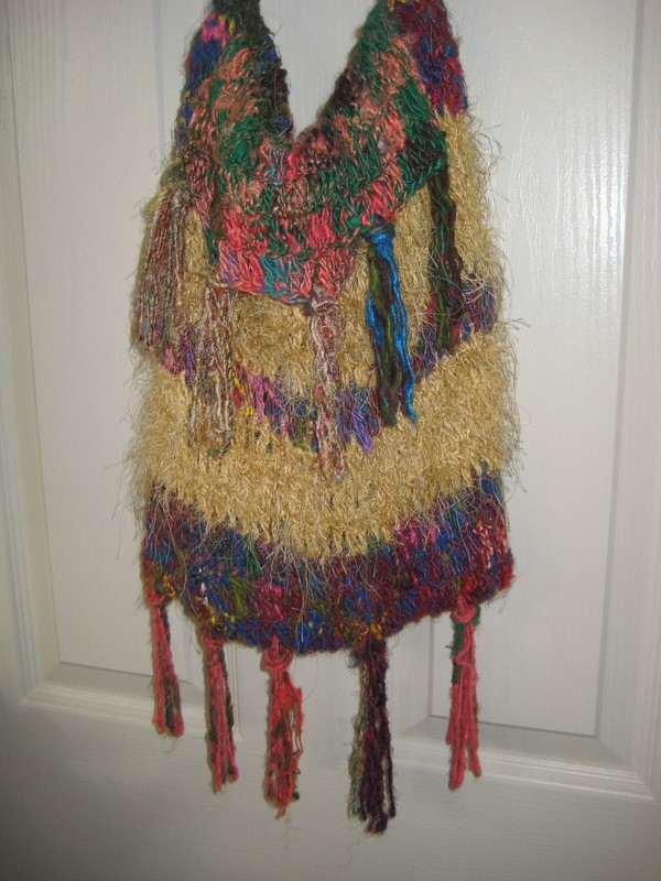 Handmade colorful handbag. Lined w attached closure Crocheted /knitted. gallery