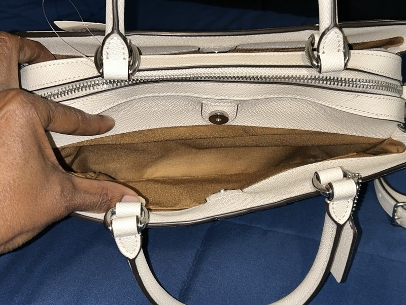 Coach Lillie carryall bag with varsity stripes in a creamy white/eggshell color gallery