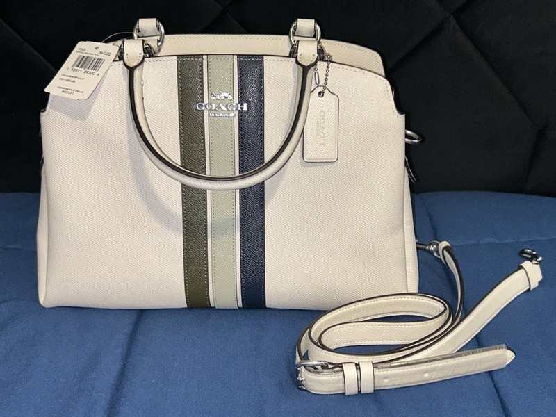 Coach Lillie carryall bag with varsity stripes in a creamy white/eggshell color gallery