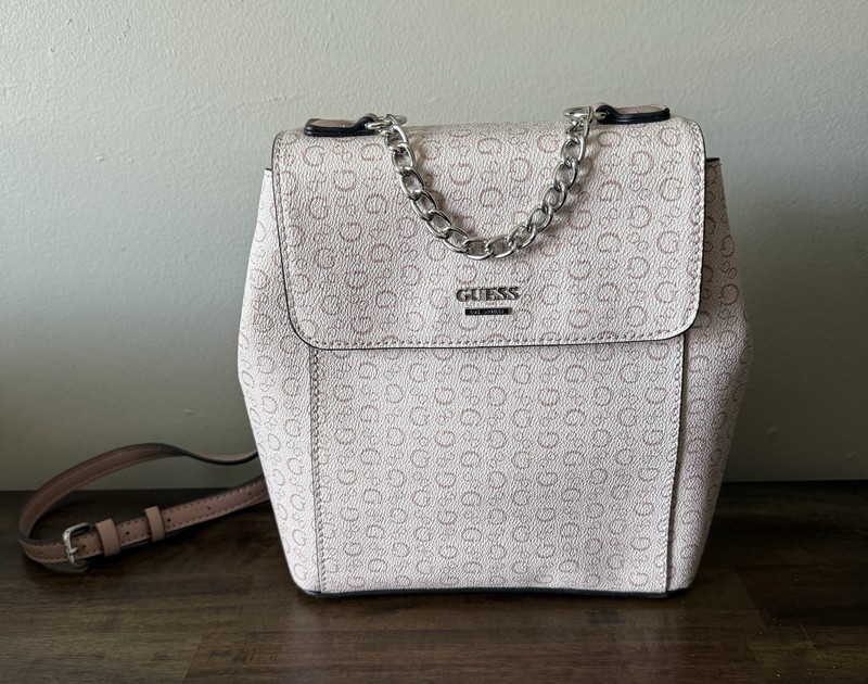 GUESS Wesley mini backpack in a light rose pink.