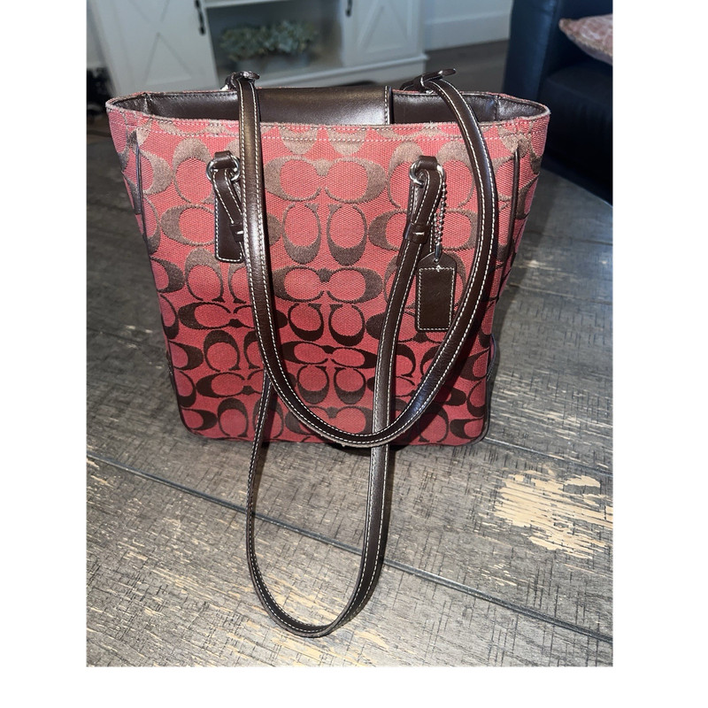 a vintage Coach Signature tapestry and leather tote bag, a red/brown monogram