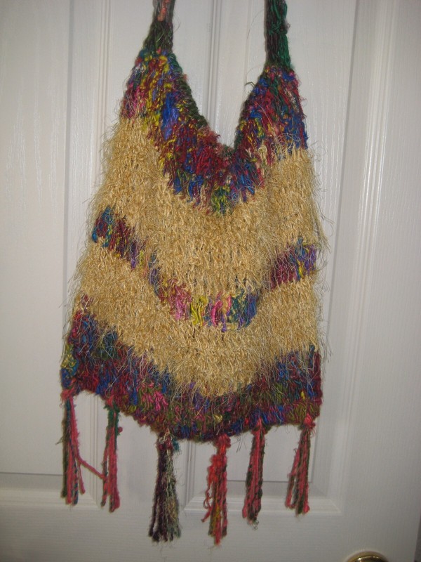 Handmade colorful handbag. Lined w attached closure Crocheted /knitted. gallery
