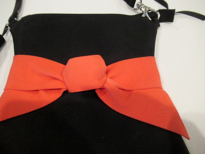 Black purse with red bow and black tassel, evening bag gallery